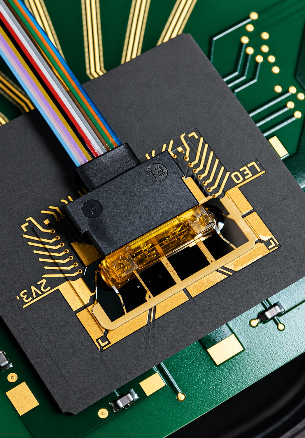 LEO-OTRx-NPO VCSEL optical engine mounted on an electronic test board, shown beside a two-cent coin for scale
